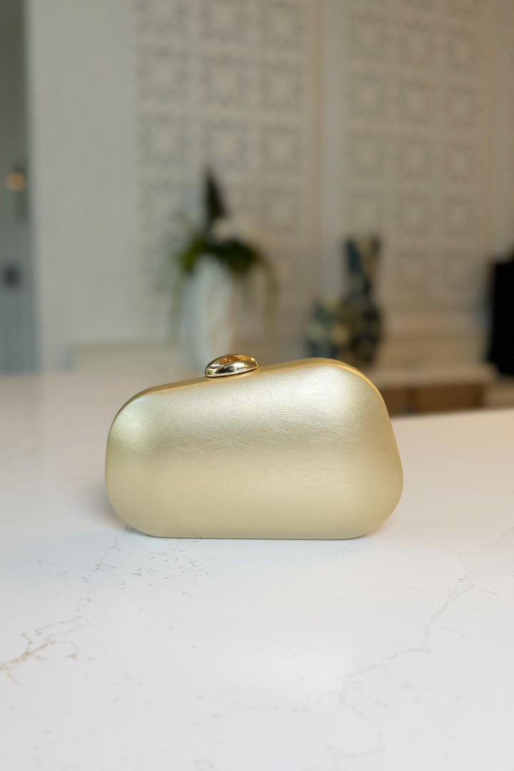 Asymmetrical Gold clasp Clutch