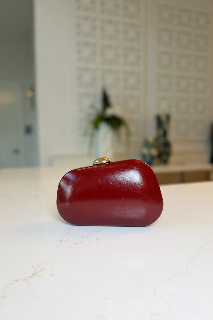 Asymmetrical Gold clasp Clutch