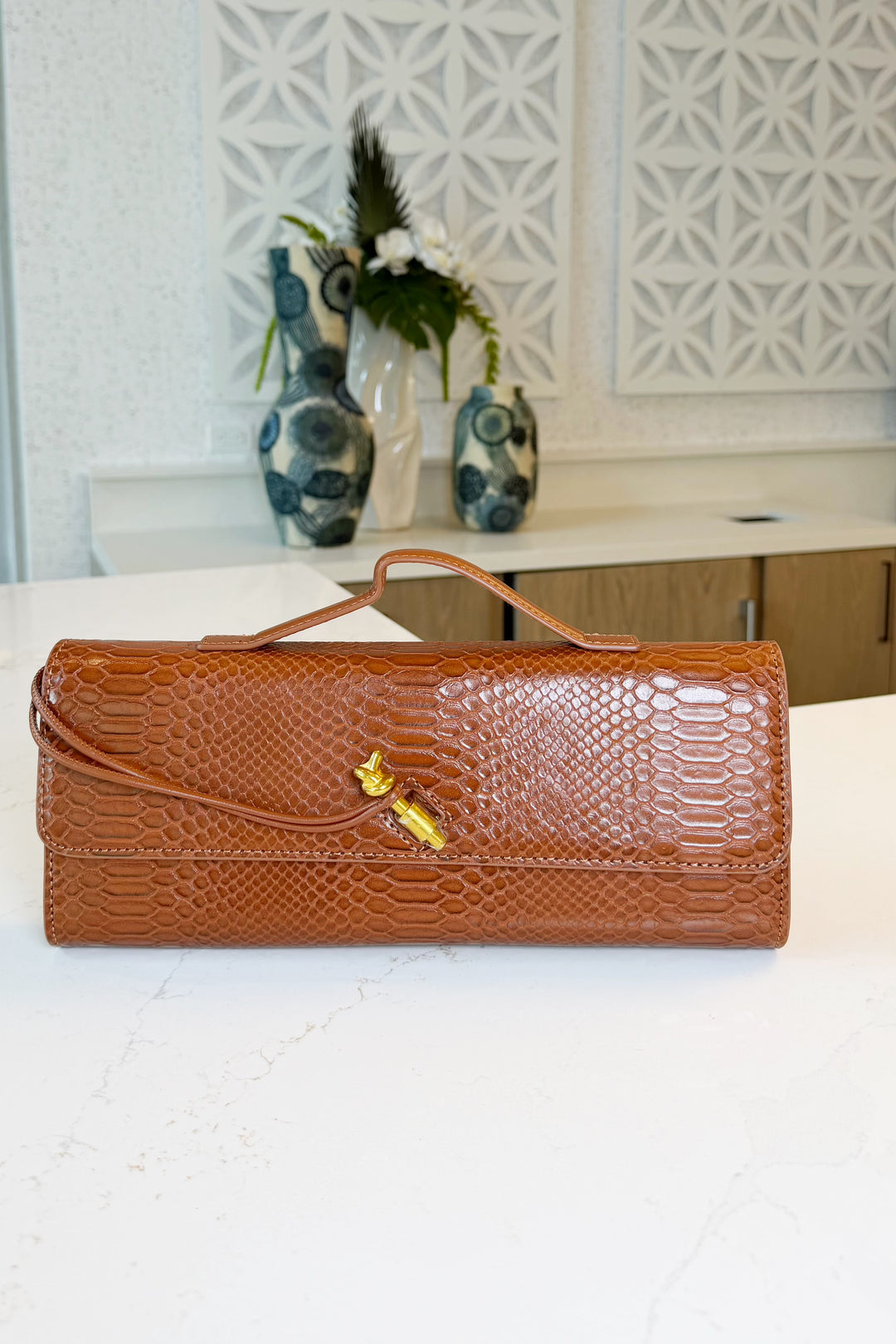 Knot detail wristlet clutch